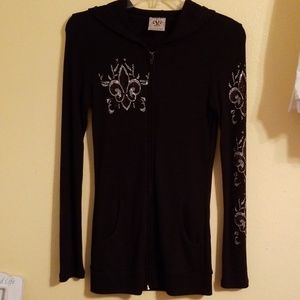 Zip up sweater with rhinestone designs.